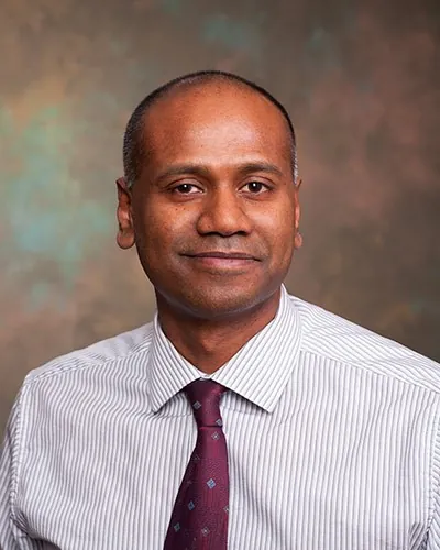 Portrait of Dr. Chindanoor Rajesh, MD, board-certified internist